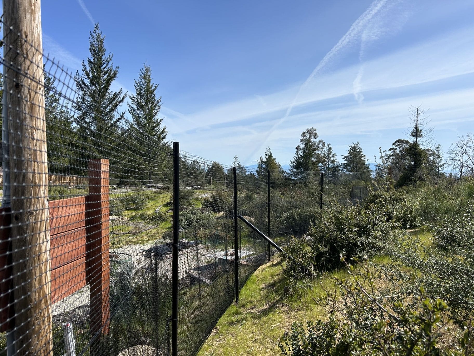 Deer fence spanning a large rural landscape